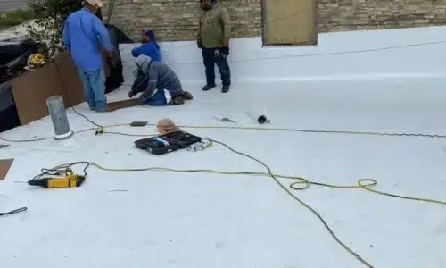 Crew working on a commercial roof.