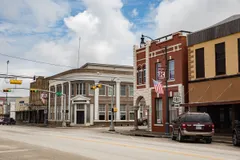 Brick storefronts beside an intersection in downtown Kenedy.