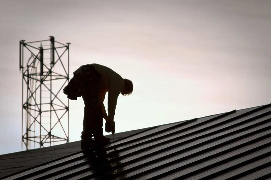 Roofer standing on a roof