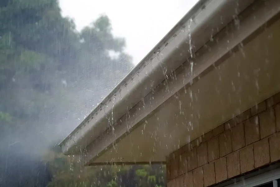 Raining on roof with gutters installed by Victoria roofers.