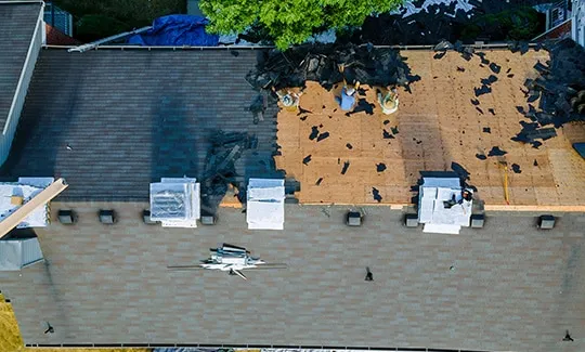 Victoria roofing contractors are finishing up a roof repair job.
