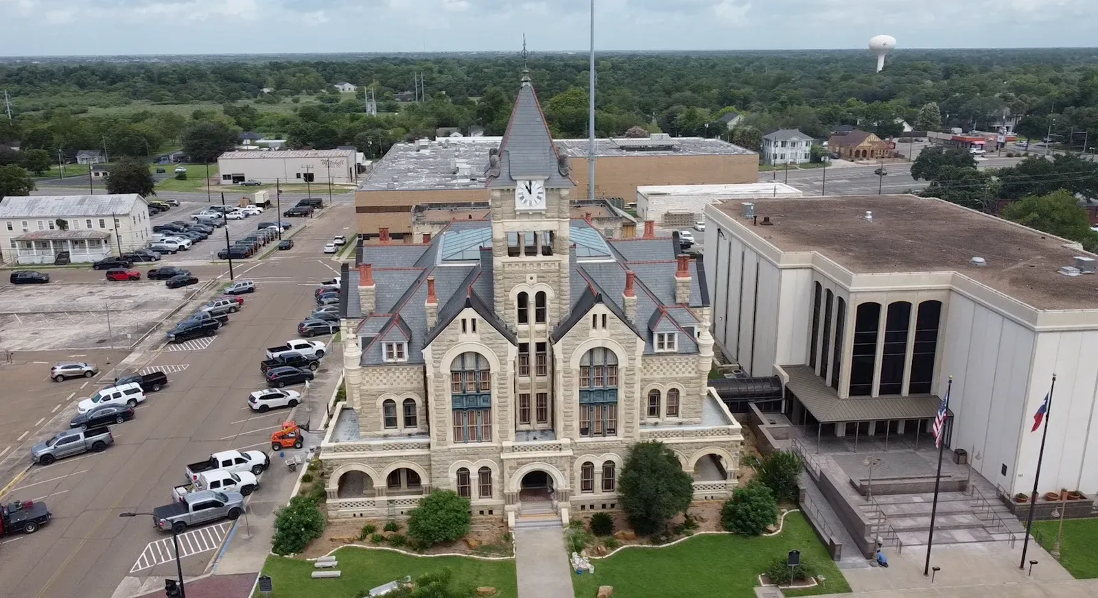 The Victoria County Courthouse and nearby rooftops in Victoria, Texas.