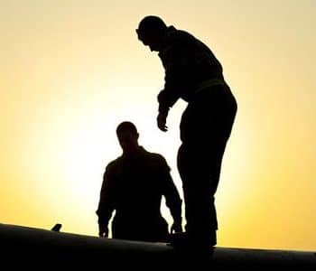 Professional roofers conduct an inspection.