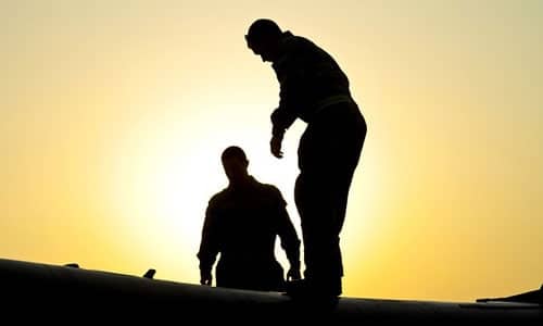 Professional roofers conduct an inspection.