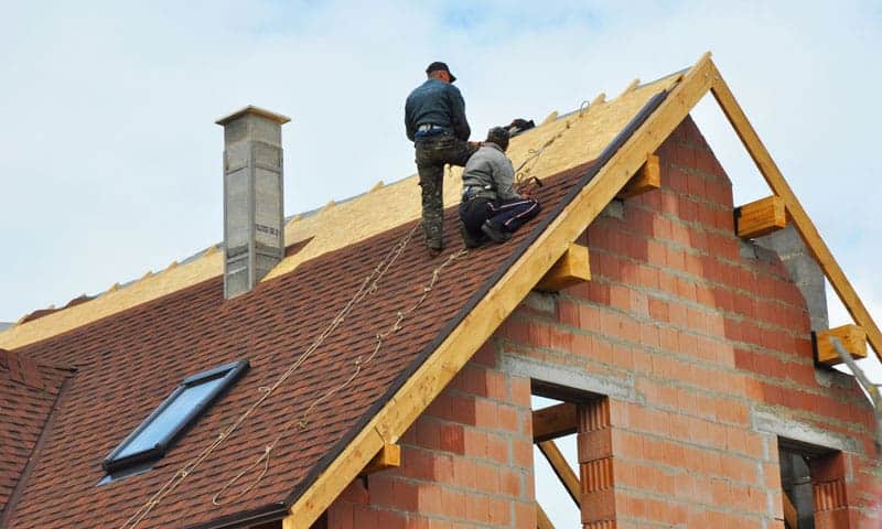 Victoria roofing contractors are finishing up a roof repair job.