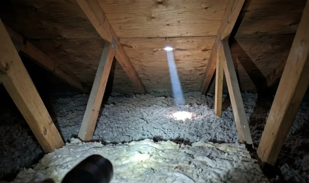 10 Warning Signs Your Roof Needs Immediate Attention 4 Daylight visible through the attic roof deck indicating a puncture