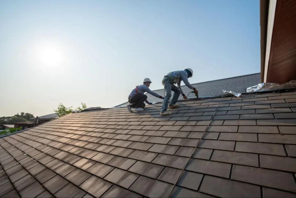 Metal Roof vs. Shingle in South Texas: What Lasts Longer in Hail and Heat 4 Roofers installing shingles on roof
